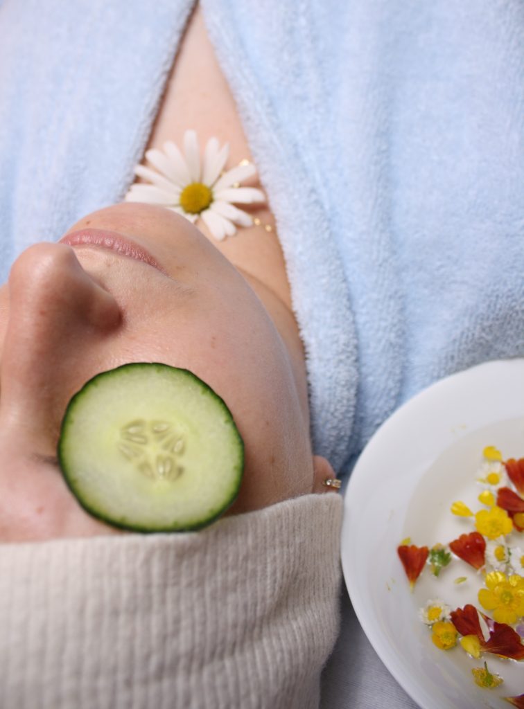 A client relaxes with cucumber on their eyes before getting a profhilo treatment in Norwich